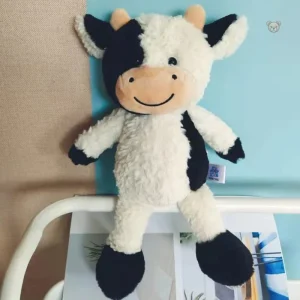 Jouet en peluche vache à la texture douce et agréable