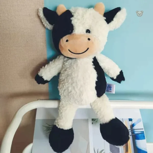 Jouet en peluche vache à la texture douce et agréable