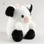 Vache en peluche, design noir et blanc, idéale pour les enfants